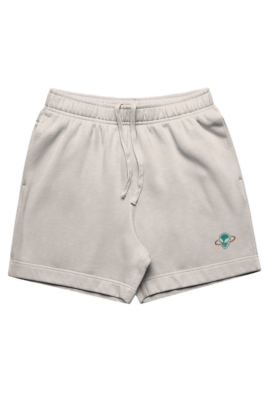 Cream color men's track shorts with small alien head in orbit on bottom left leg.